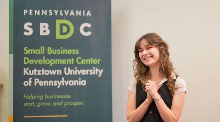 Senior Communication Design student Sarah Schafer is making an impact through her work with Kutztown University’s Small Business Development Center (KUSBDC). As a branding specialist, she helps entrepreneurs turn early ideas into clear, strategic brands—strengthening their messaging and market presence.

Most recently, she contributed to the Kutztown community map outside 27 Old Main, highlighting local businesses and encouraging community engagement.

Her work reflects how design can directly support business growth while connecting student talent with real-world experience. Way to go Sarah! #sbdc #kucd